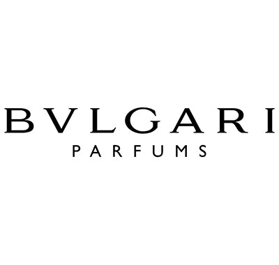 Bvlgari Omnia Crystalline perfume bottle with faceted, jewel-inspired design, Bvlgari Aqva Pour Homme cologne in ocean-blue round bottle, Luxury Bvlgari fragrance collection displayed with Italian-inspired decor