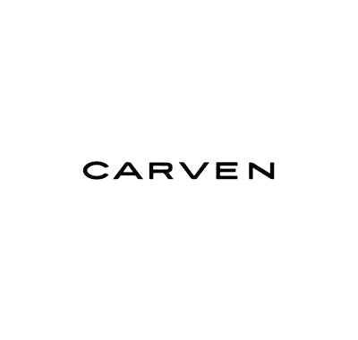 Carven Le Parfum bottle with soft pastel green cap and elegant white ribbon, Carven Dans Ma Bulle perfume bottle with round cap and modern glass design, Woman applying Carven perfume in a Parisian-inspired setting