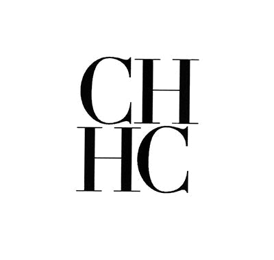 Carolina Herrera Good Girl perfume bottle shaped like a high heel, Carolina Herrera CH Eau de Parfum in classic rectangular glass bottle, Woman spraying Carolina Herrera perfume in glamorous setting
