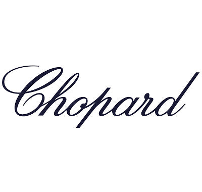 Chopard Wish Eau de Parfum bottle shaped like a diamond, Collection of Chopard perfumes displayed with jewelry-inspired aesthetics, Woman holding Chopard fragrance bottle in a glamorous setting